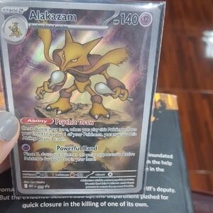 Pokemon Alakazam Trading Card - Yellow and Brown
